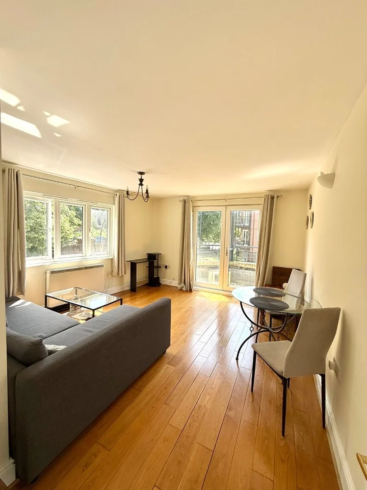 Dual-aspect living room with balcony doors and natural light